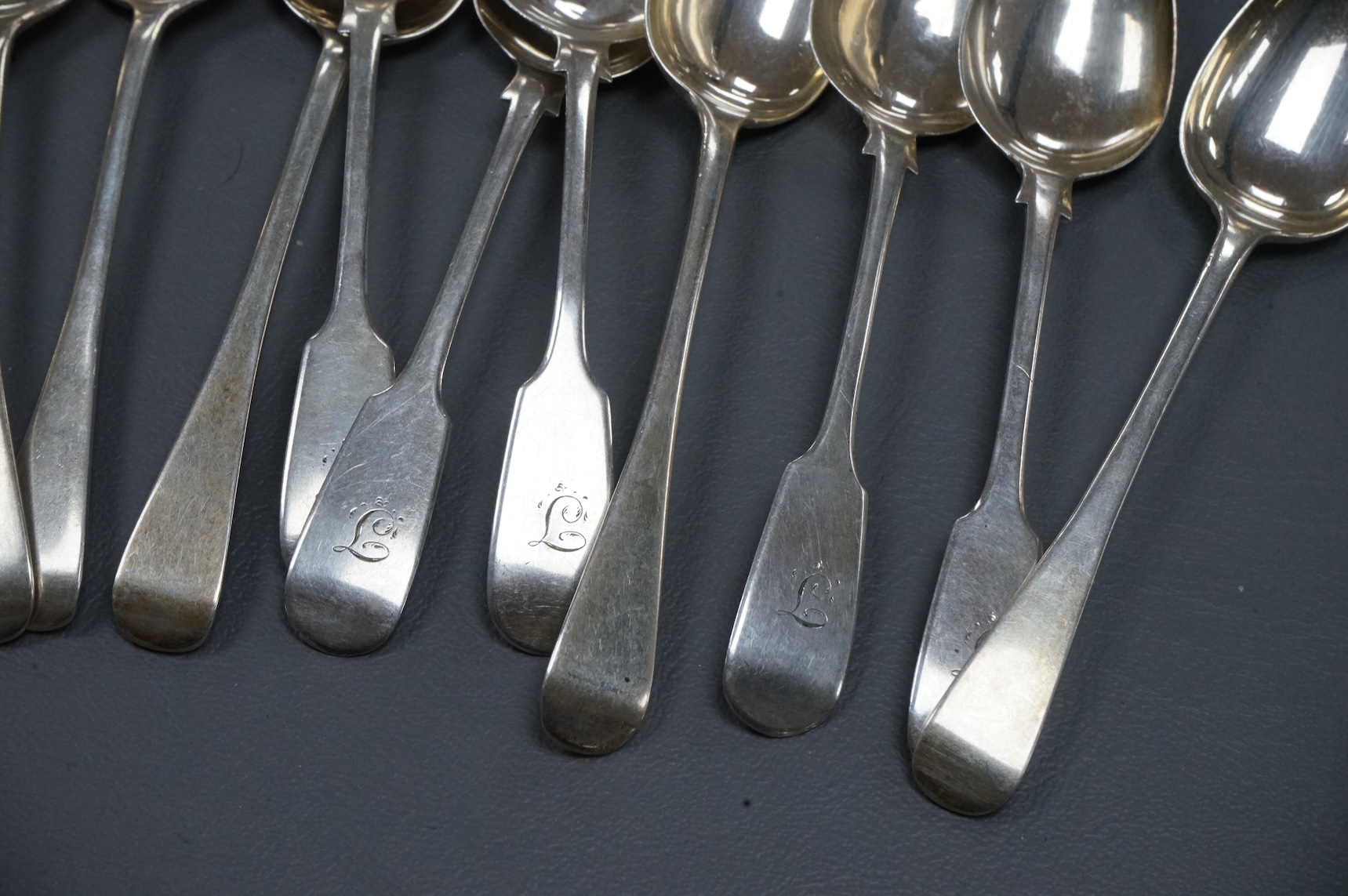 A set of eight George IV silver Old English pattern teaspoons, William Eaton, London 1827, 14.2cm, together with a set of six early Victorian provincial silver fiddle pattern teaspoons, by John Walton, Newcastle, 1842, 7
